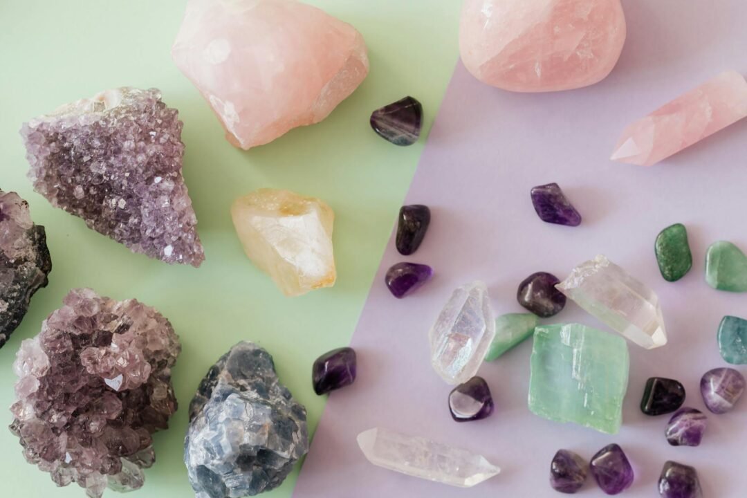 pexels-photo-4040644-4040644 A variety of crystals and gemstones including amethyst and rose quartz on a pastel background.