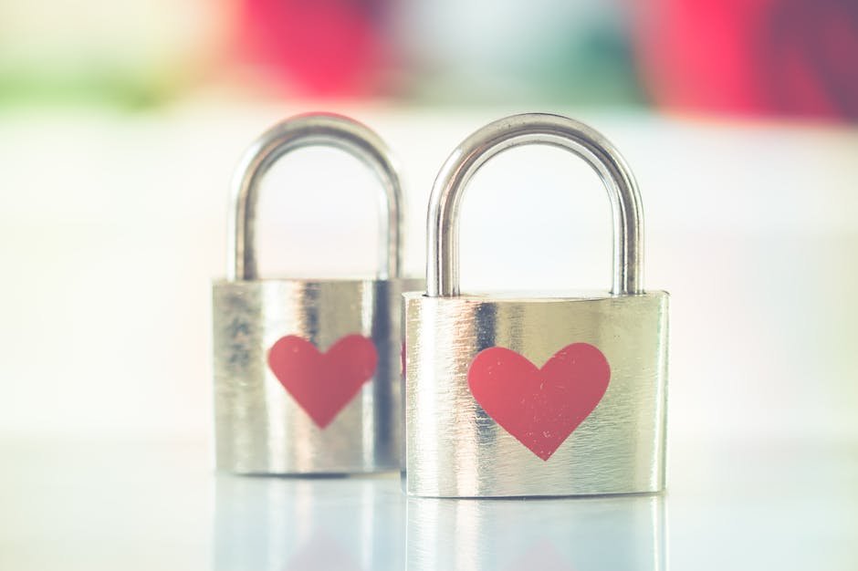 pexels-photo-843231-843231 Two silver padlocks with heart symbols, representing love and romance.